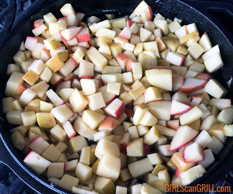 diced apples in a cast iron skillet
