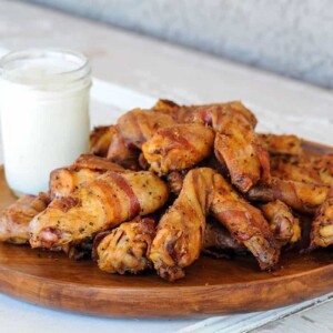 platter of bacon wrapped chicken wings.