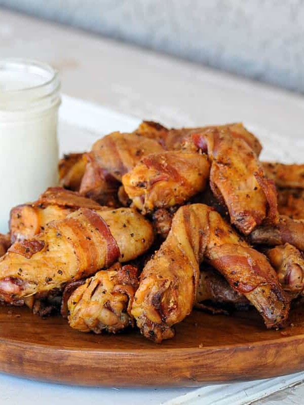 platter of bacon wrapped chicken wings.
