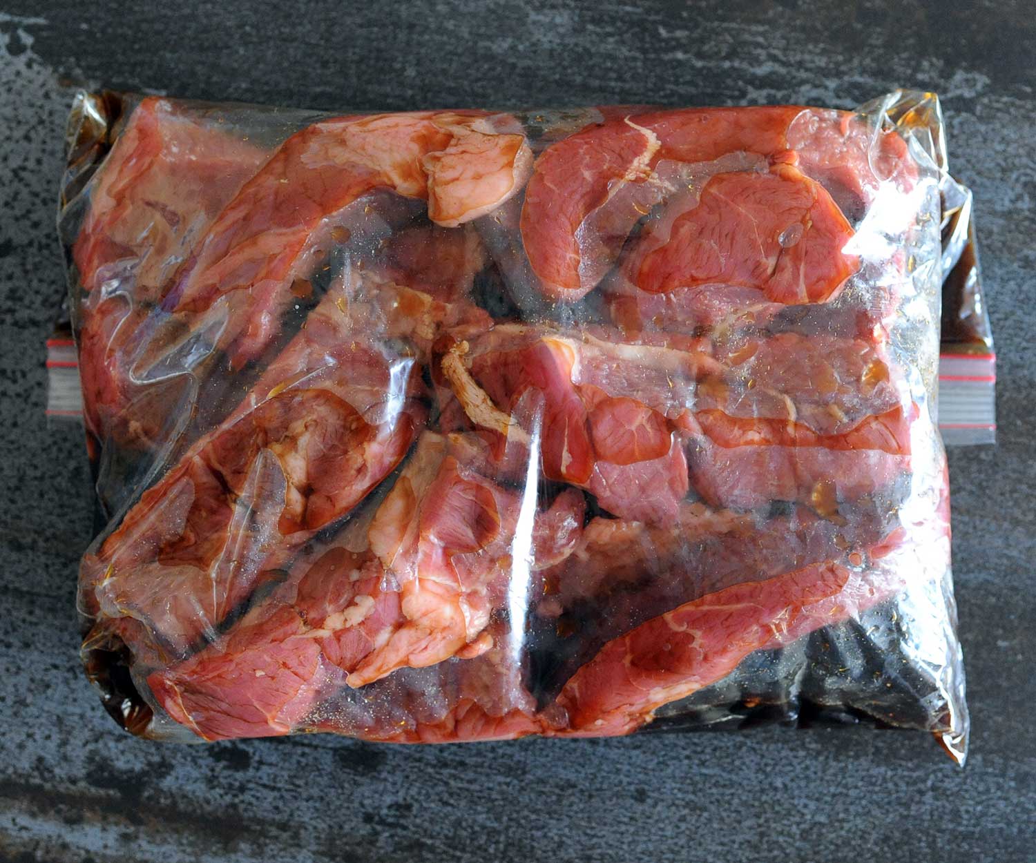 boneless beef ribs marinating in bag