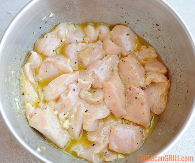 bowl of diced chicken in lemon marinade