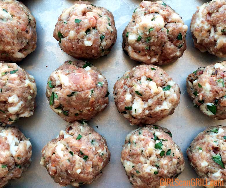 raw meatballs with cheese and parsley