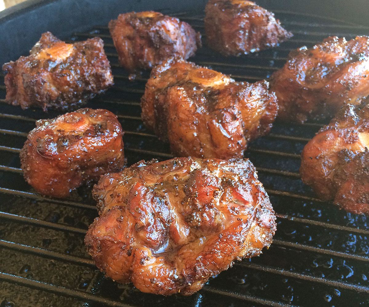 oxtails smoking on Big Green Egg.