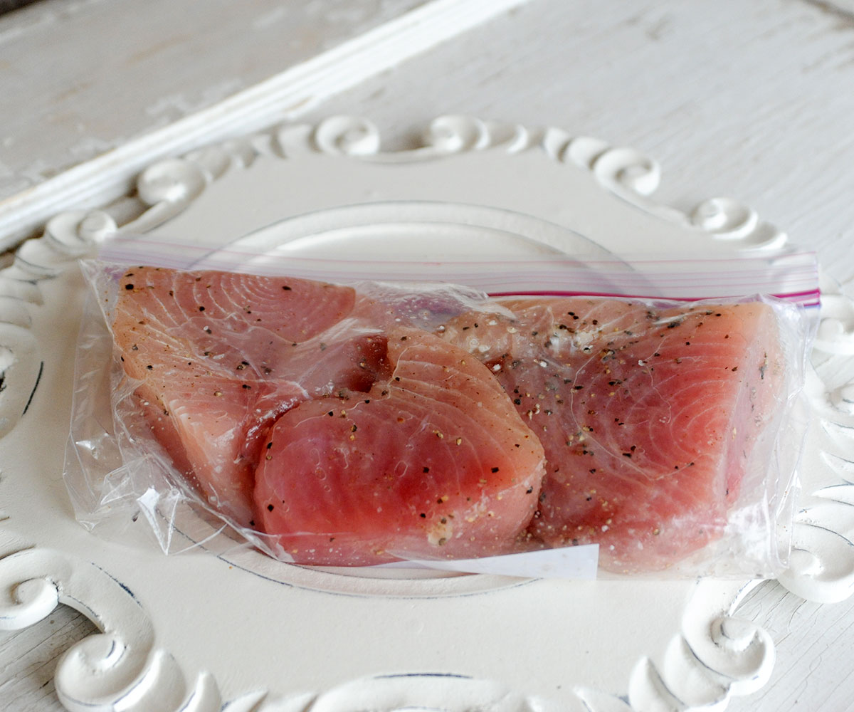 tuna steaks marinating in bag.