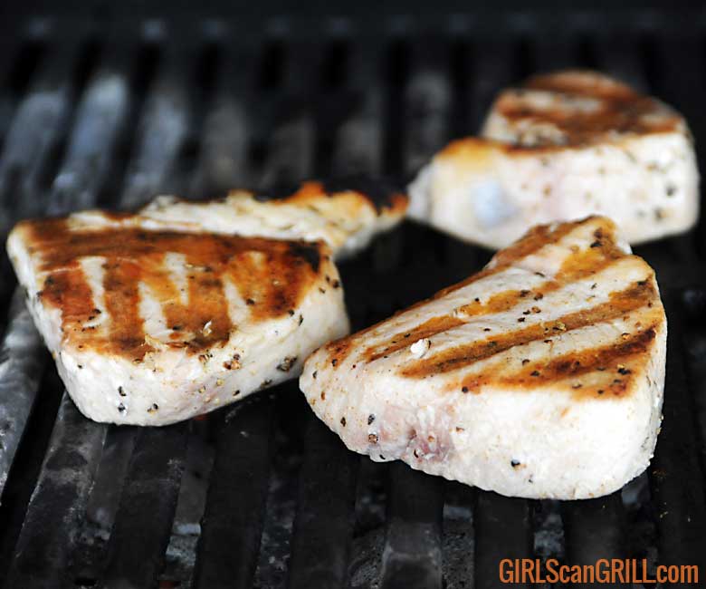 tuna steaks cooking on grill