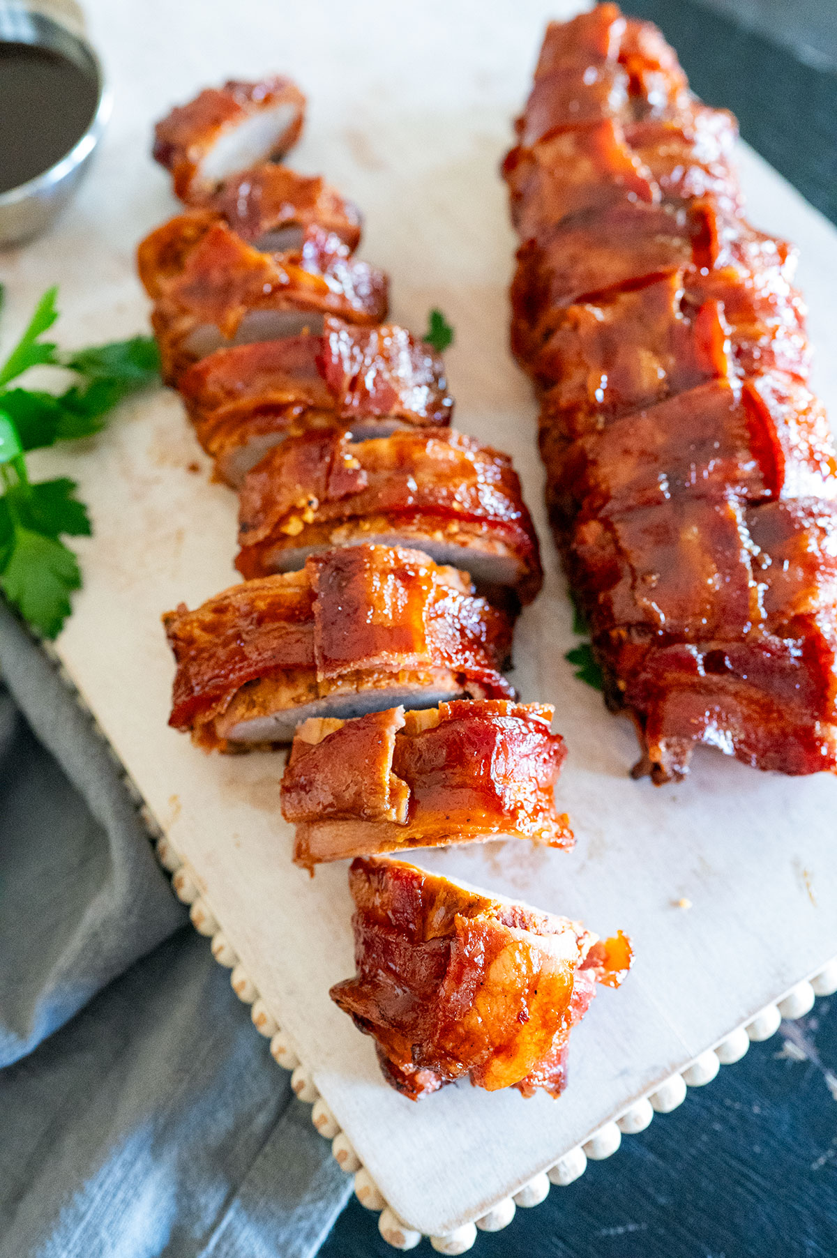 Sliced bacon-wrapped pork tenderloin.