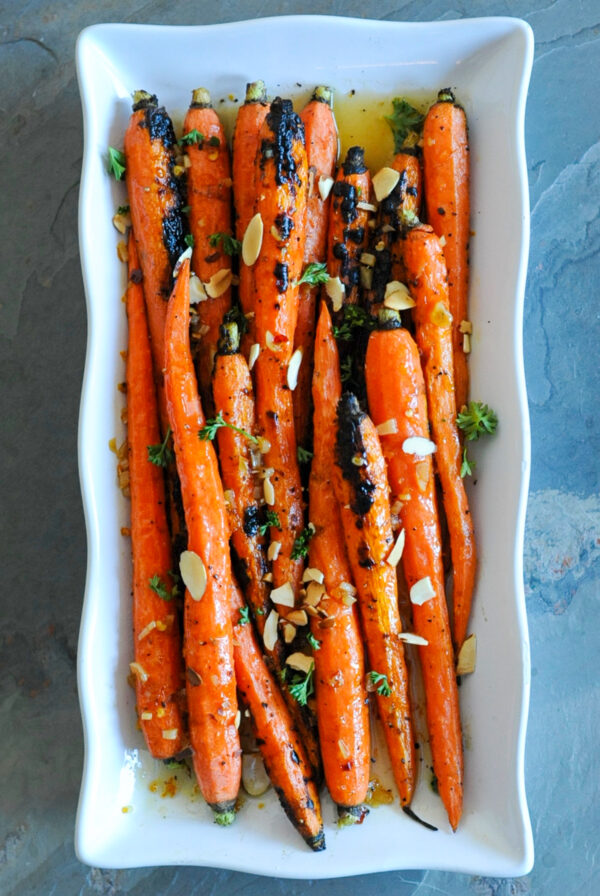 Grilled maple glazed carrots on a plate.