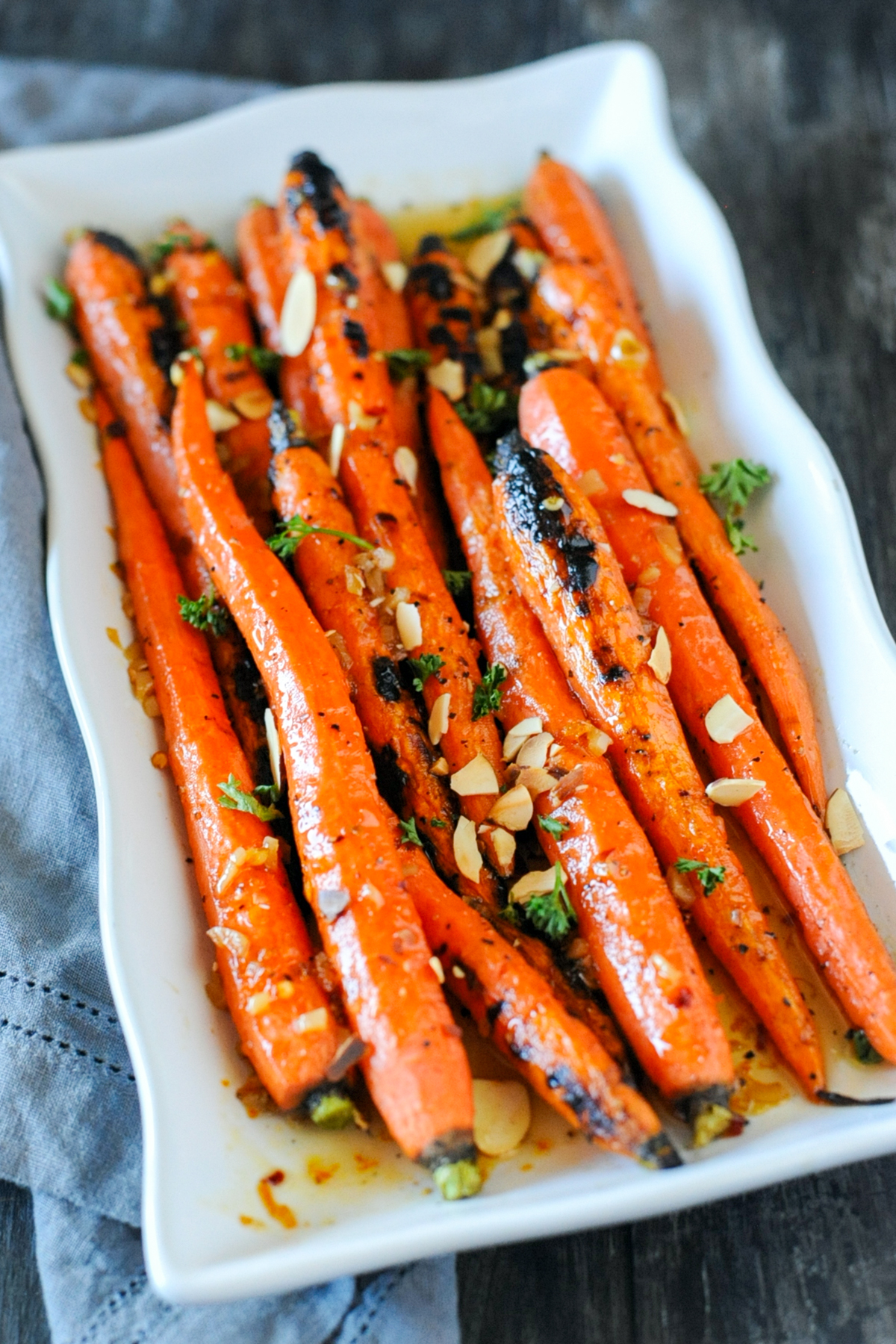 Grilled maple glazed carrots on a plate.