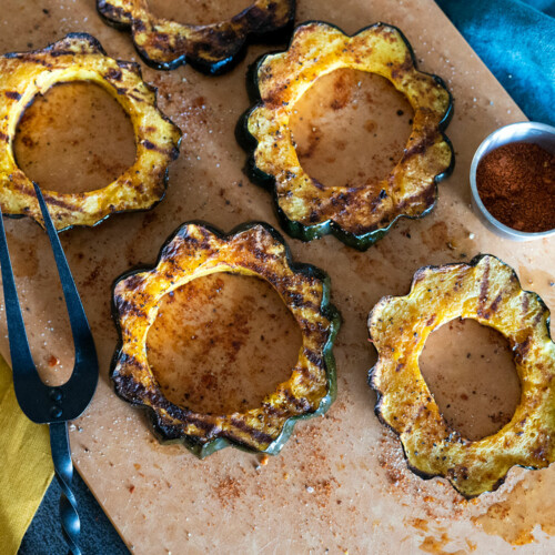 grilled acorn squash rings on a platter.