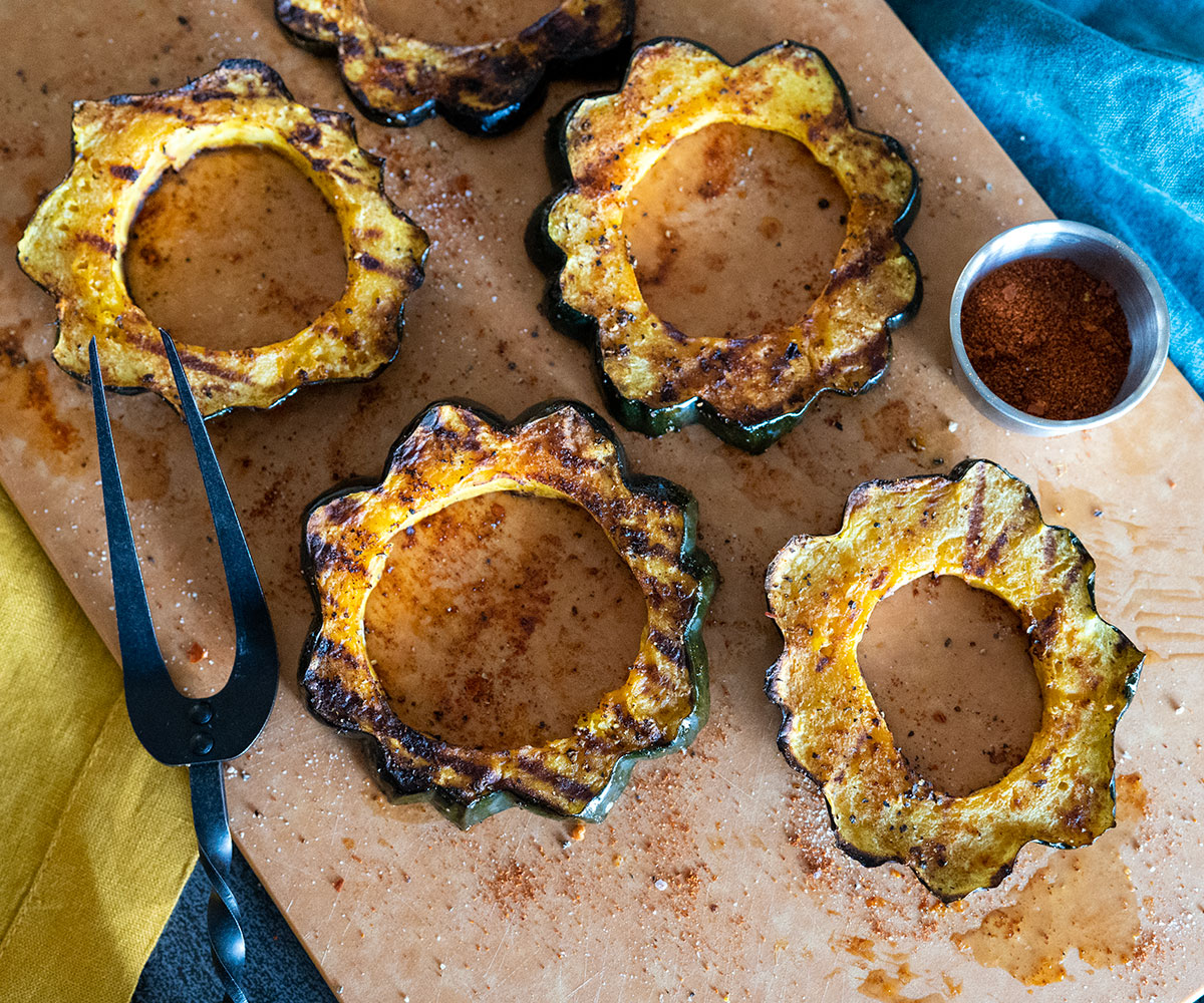 Grilled acorn squash rings on a platter