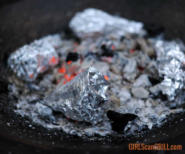 foil wrapped cones on coals