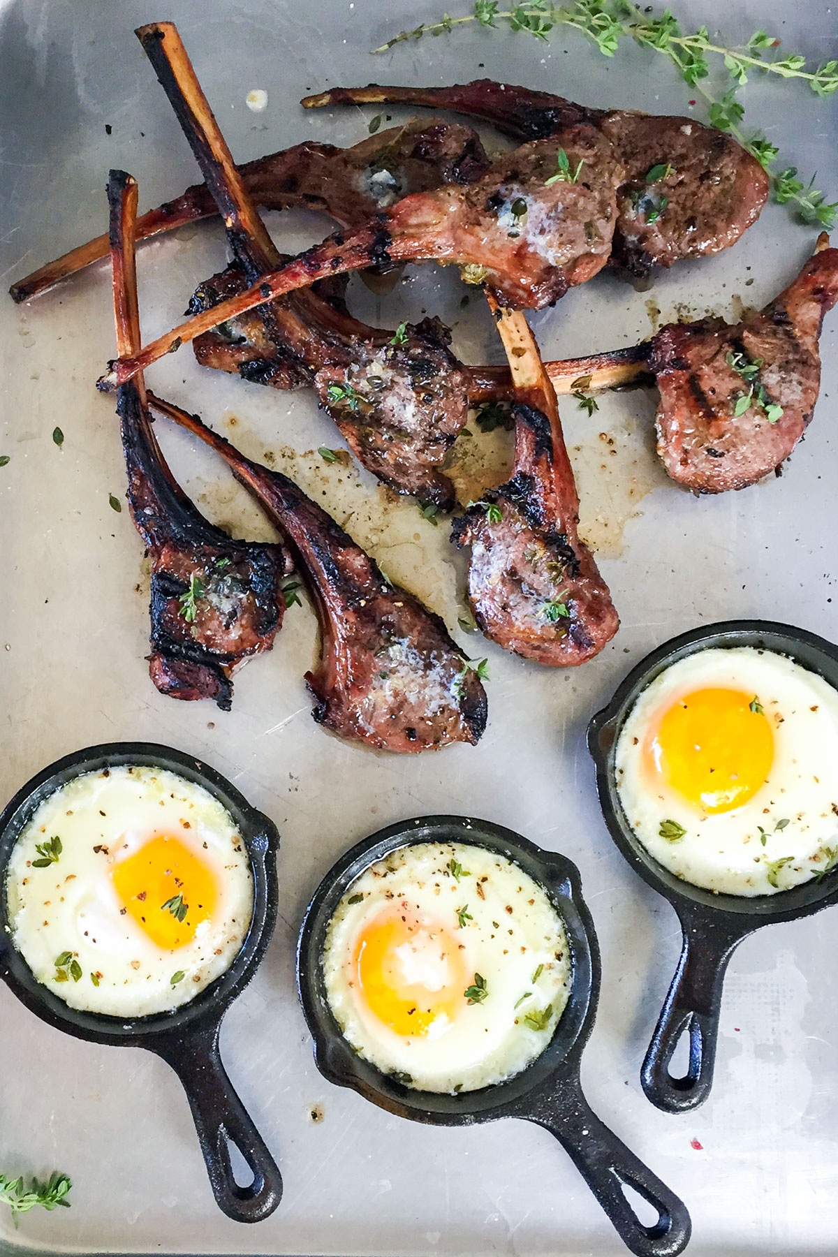 Grilled lamb chops and fried eggs.