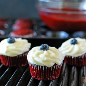 red white and blue cupcake on a grill grate