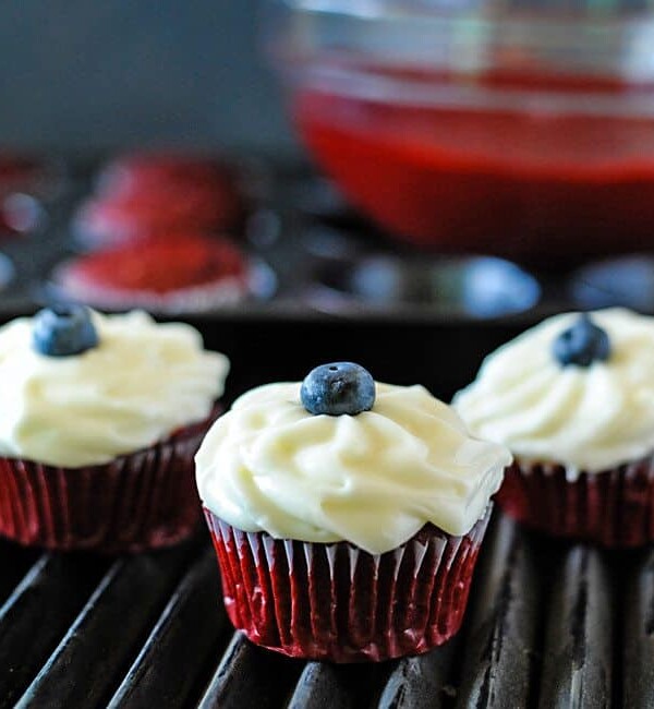 red white and blue cupcake on a grill grate