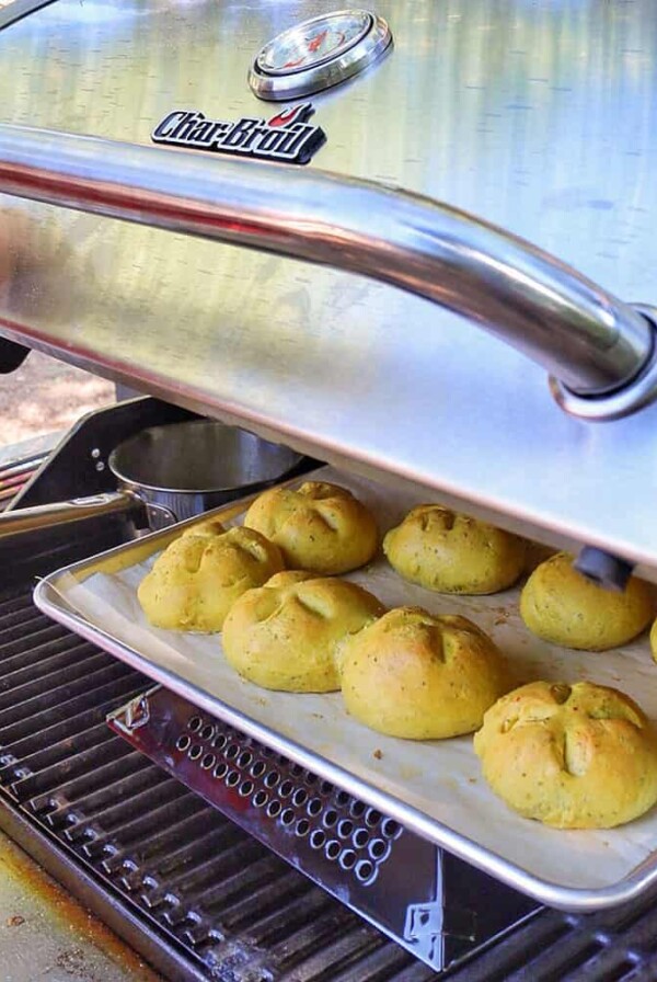 opening grill to reveal baked rolls inside