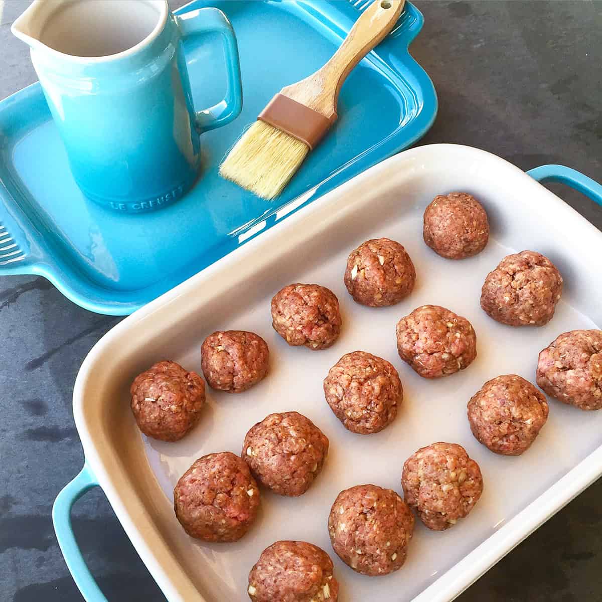 shaped meatballs on pan.