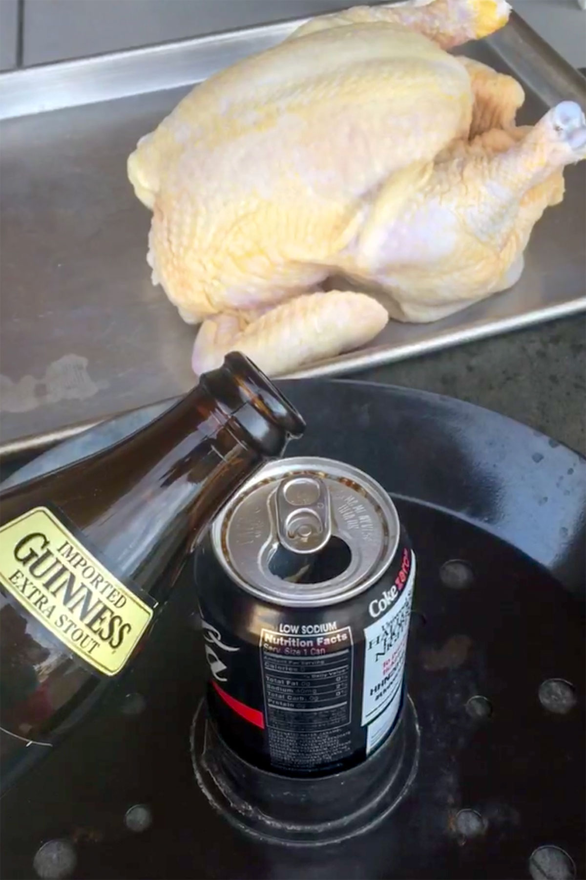 Pouring bottle of Guinness into empty soda can.