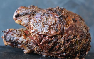 grilled prime rib resting on platter
