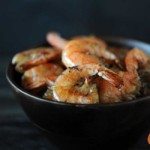 black bowl with 7 grilled shrimp inside
