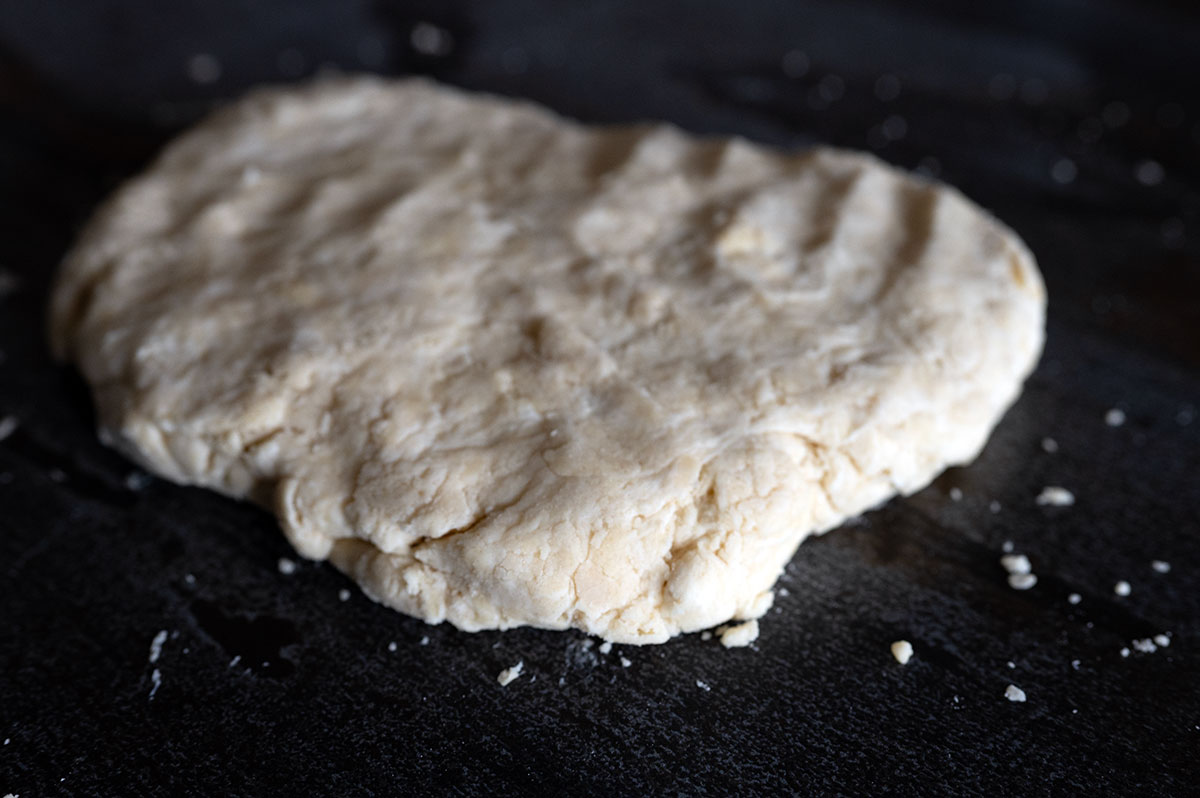 flattened biscuit dough about 1/2 inch thick