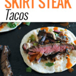 grilled skirt steak tacos on black background