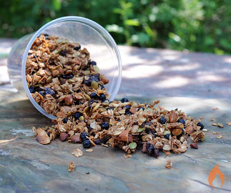 container of granola spilling onto table