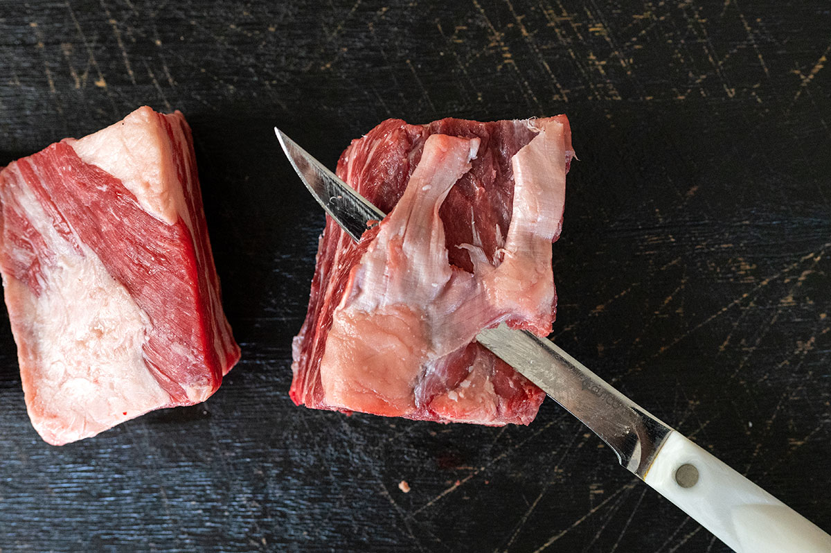 knife removing silver skin on short ribs.