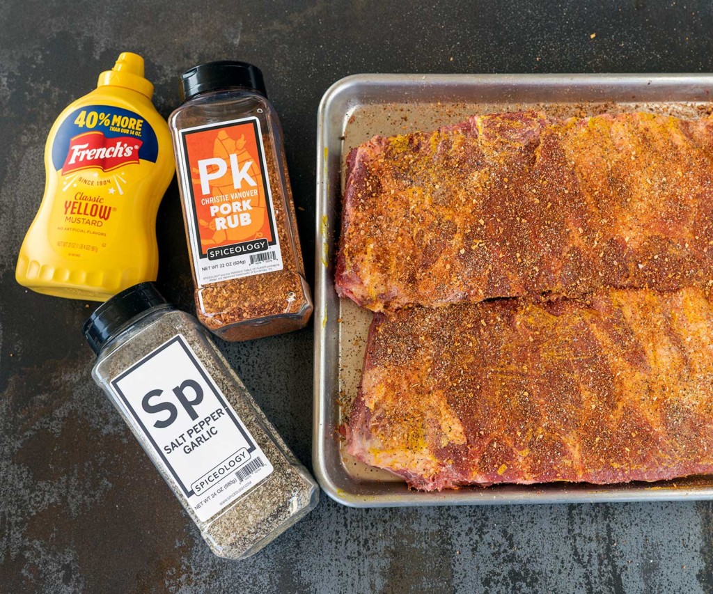 two slabs of ribs by mustard and rubs