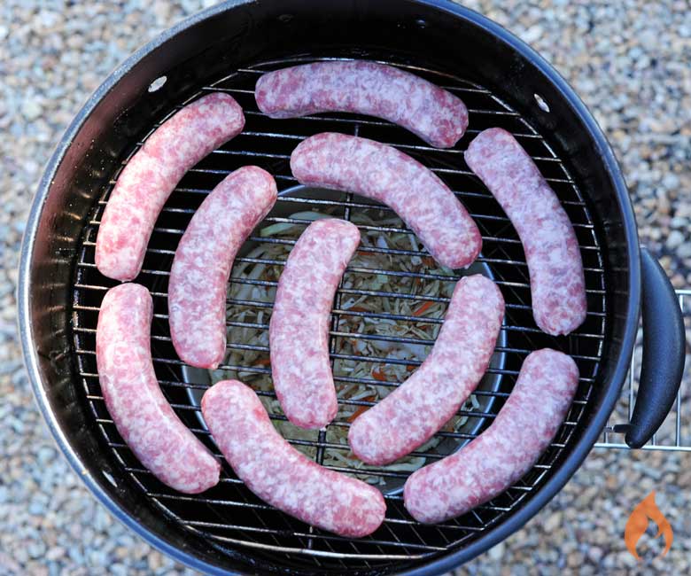 bratwurst aligned in a circle on a grill grate