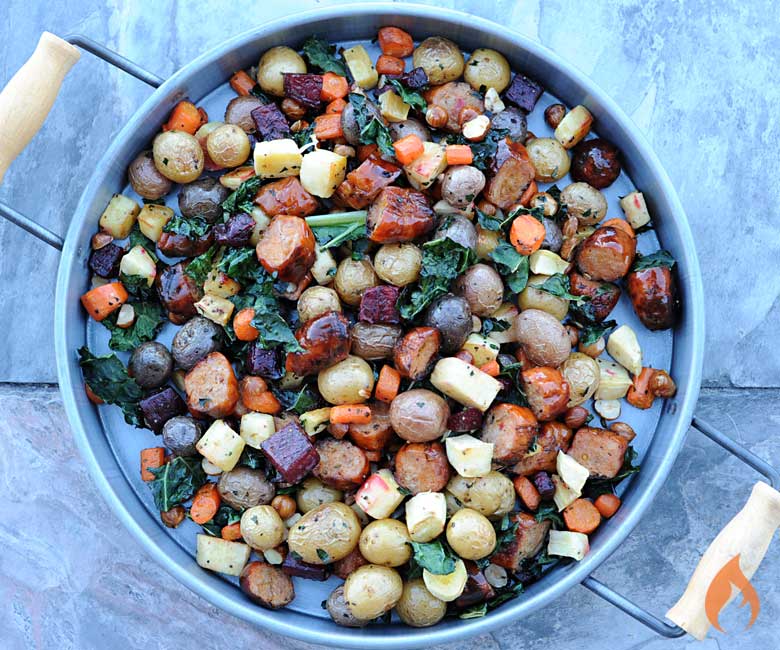Overhead photo of roasted root vegetables on a round platter