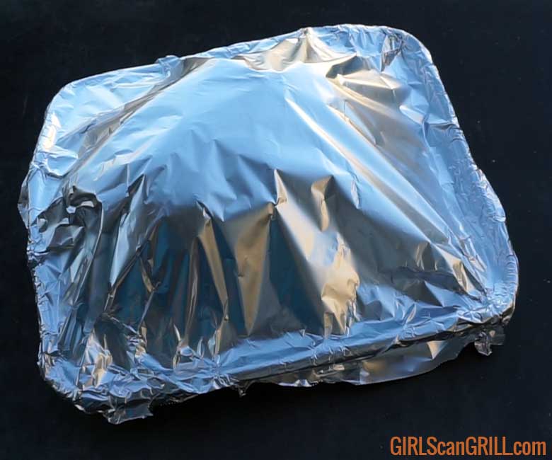 rectangle pan covered with foil on black table