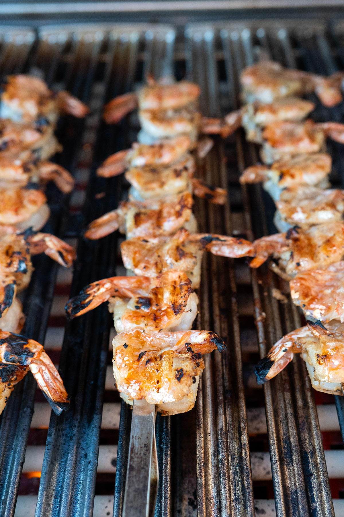 skewered shrimp cooked on grill.