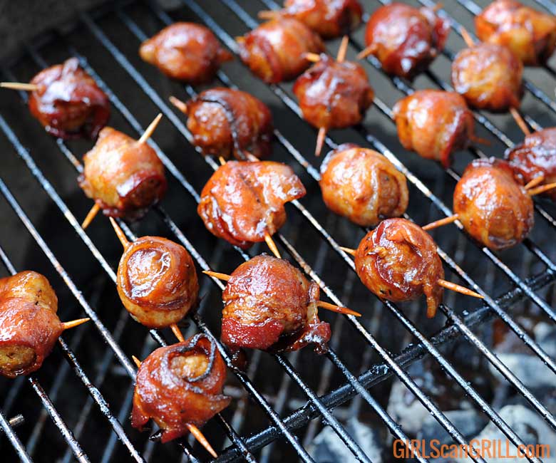 grill full of sauced bacon-wrapped meatballs - moink balls