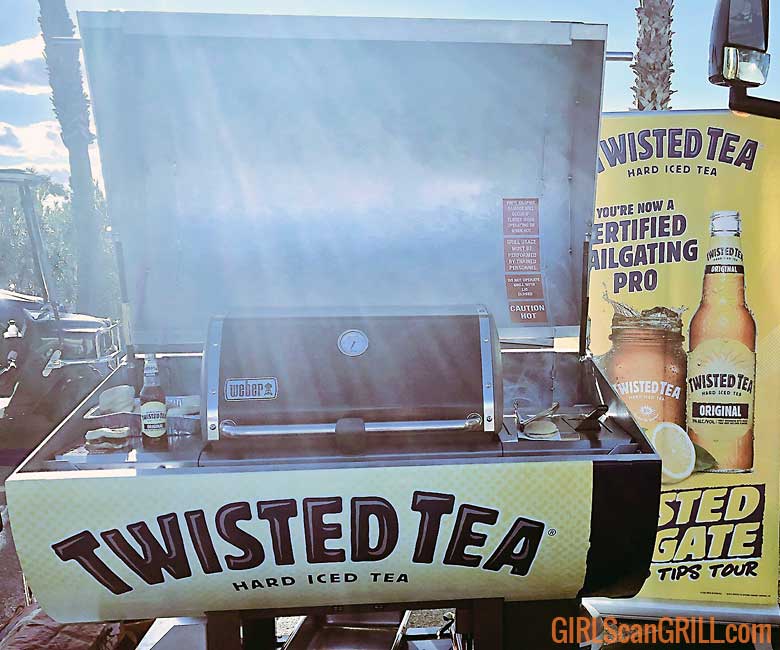 a weber grill inside the Twisted Tea grill casing