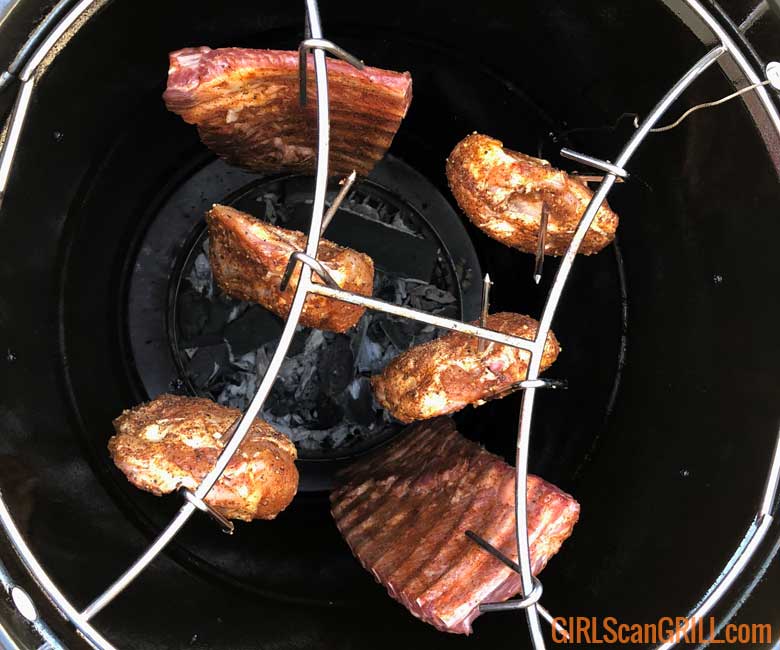 view from top of 6 pieces of meat hanging in grill