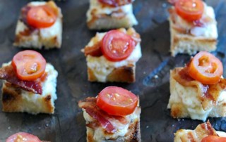 3 vertical rows of hot brown sliders topped with tomatoes