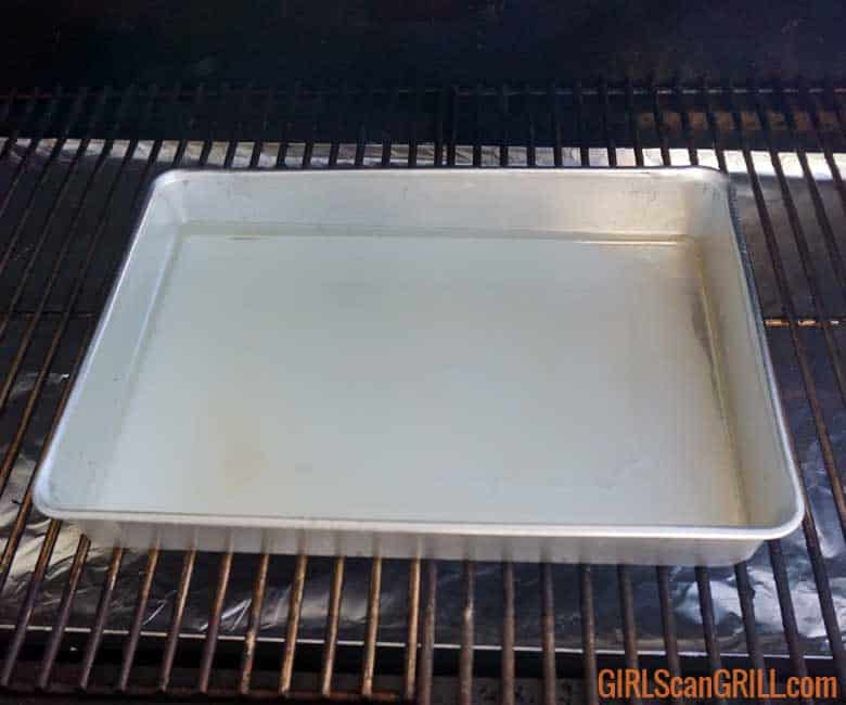 13 x 9 aluminum pan in grill with water inside