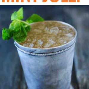 smoked mint julep on gray background with mint sprig