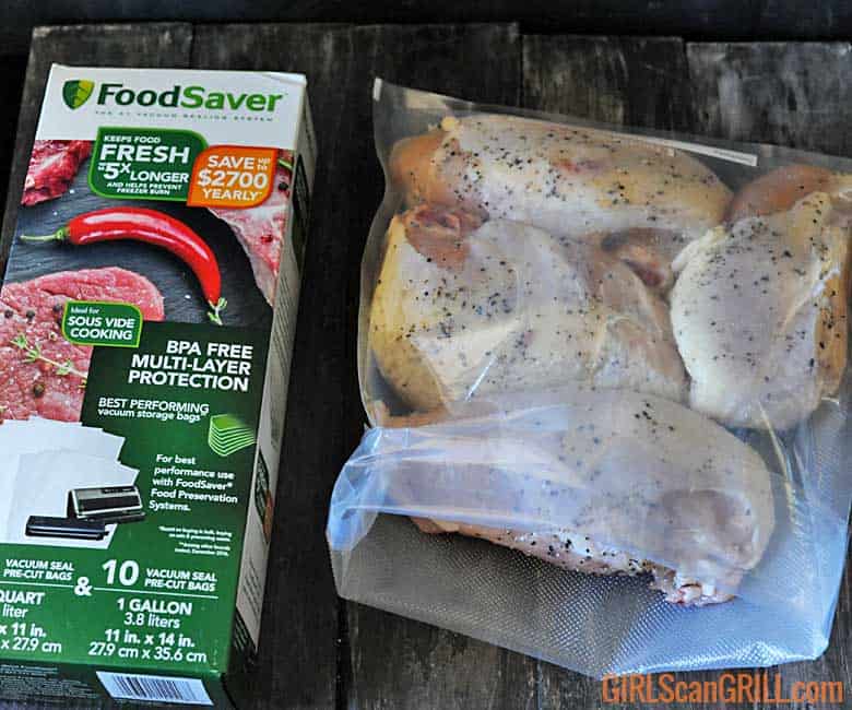 4 chicken breasts in a FoodSaver sous vide bag by box of bags