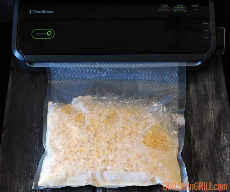 Creamed corn in a sous vide bag being sealed