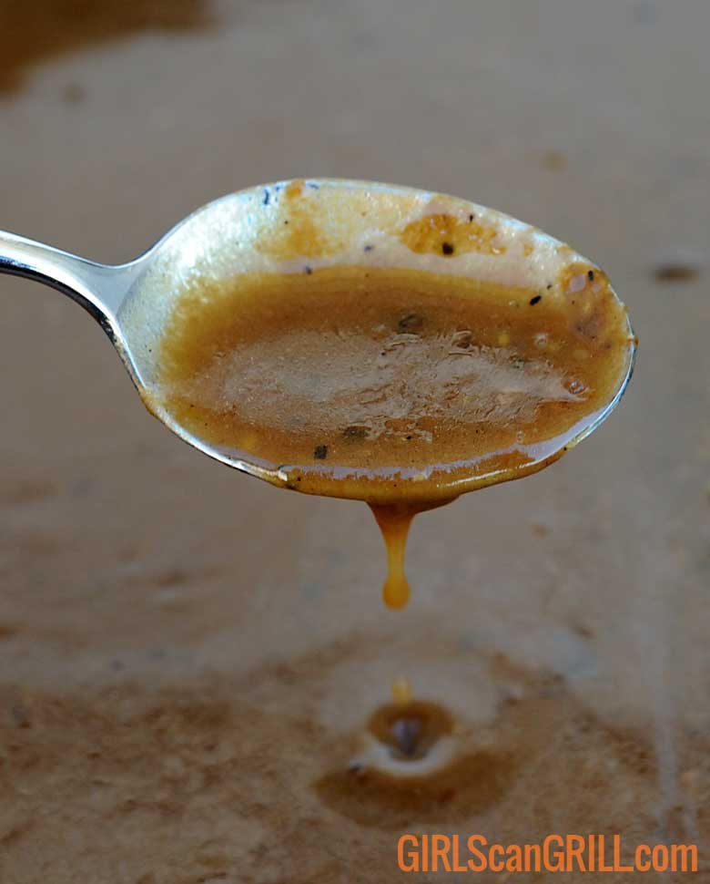 spoon with dripping gravy.