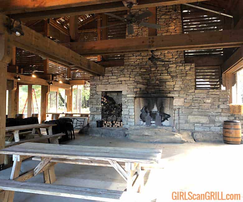 a stone fireplace with an iron pig inside