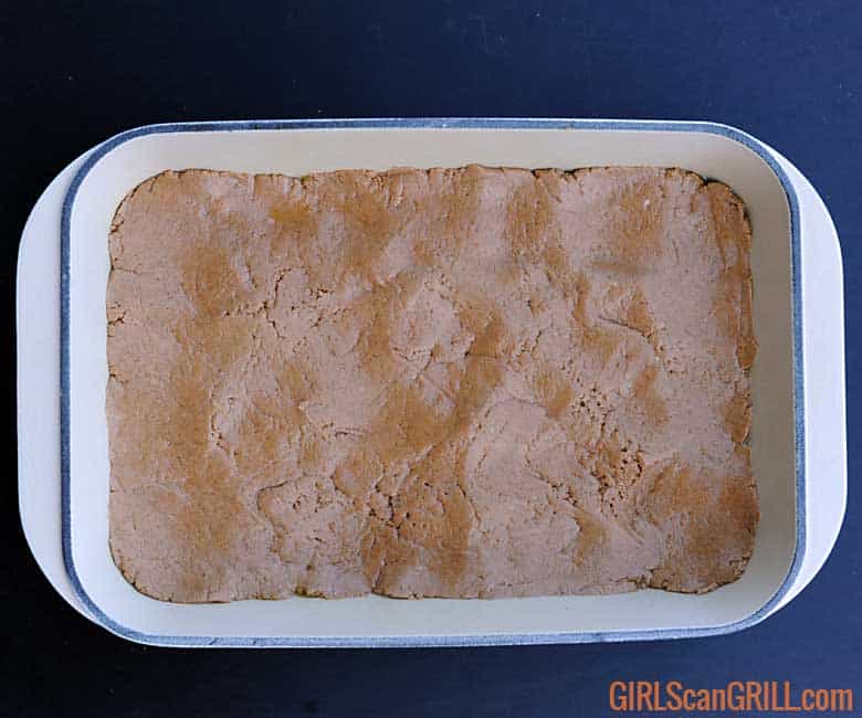 13x9 pan with raw butter cake pressed in bottom