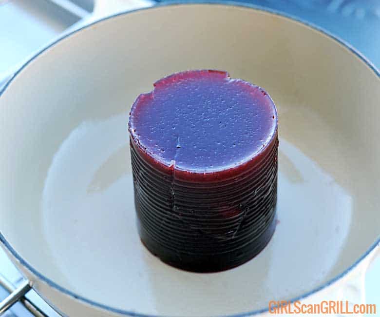 can-shaped cranberry sauce in white pot.