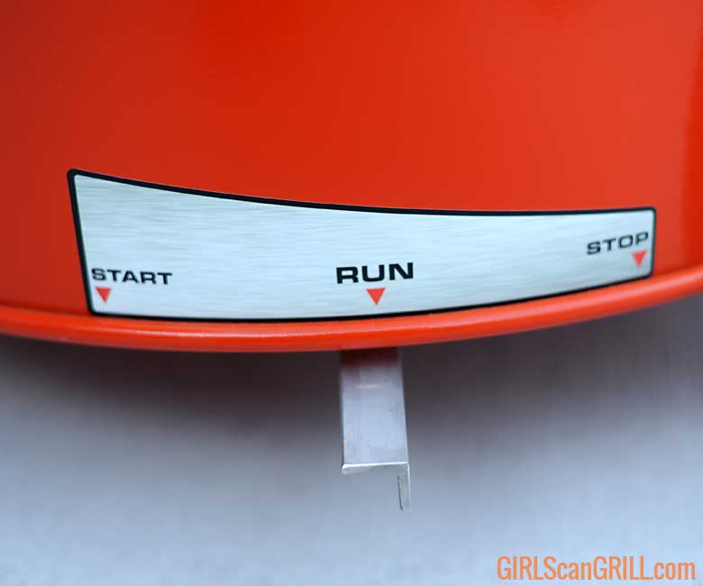 bottom of orange barrel drum showing start, run, stop lever