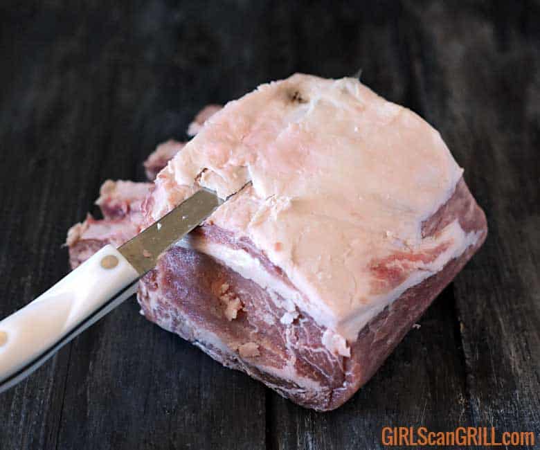 removing the fat from the pork prime rib roast