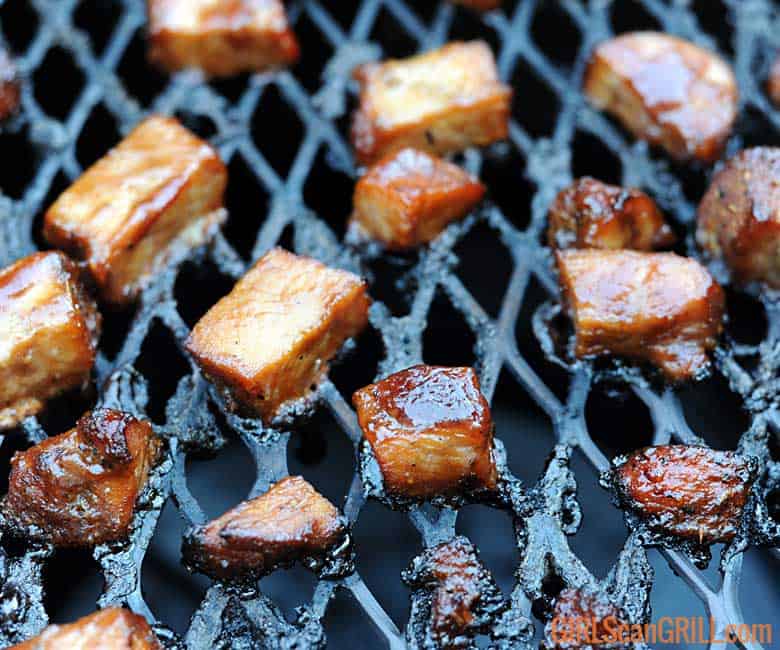 sauced turkey burnt ends on grill.