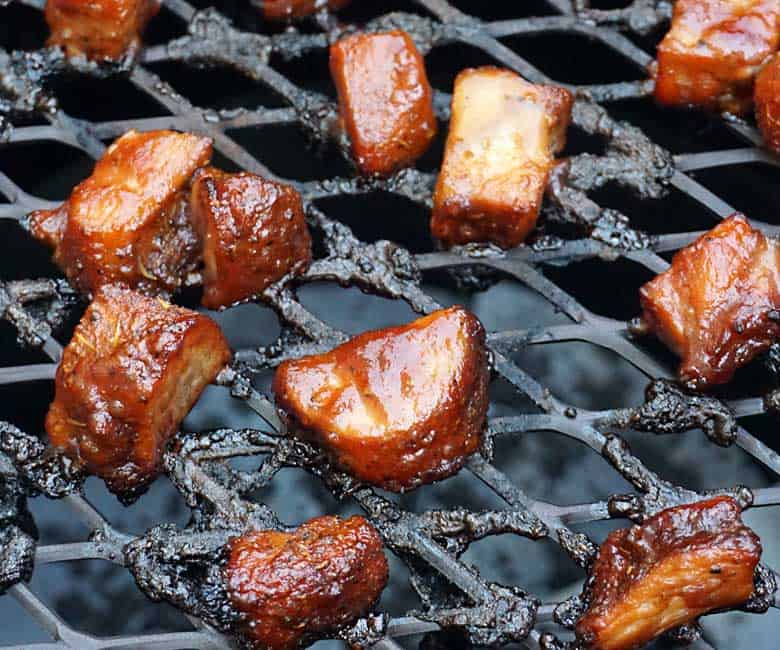 sauced turkey burnt ends on grill.