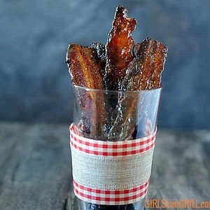 spicy mustard brown sugar bacon in glass with ribbon around it