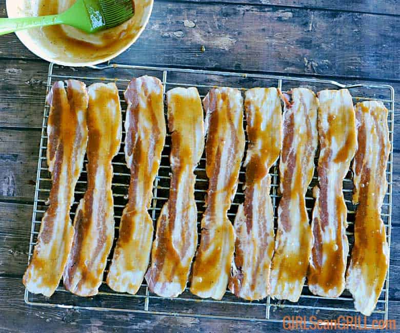 strips on bacon on rack brushed with glaze
